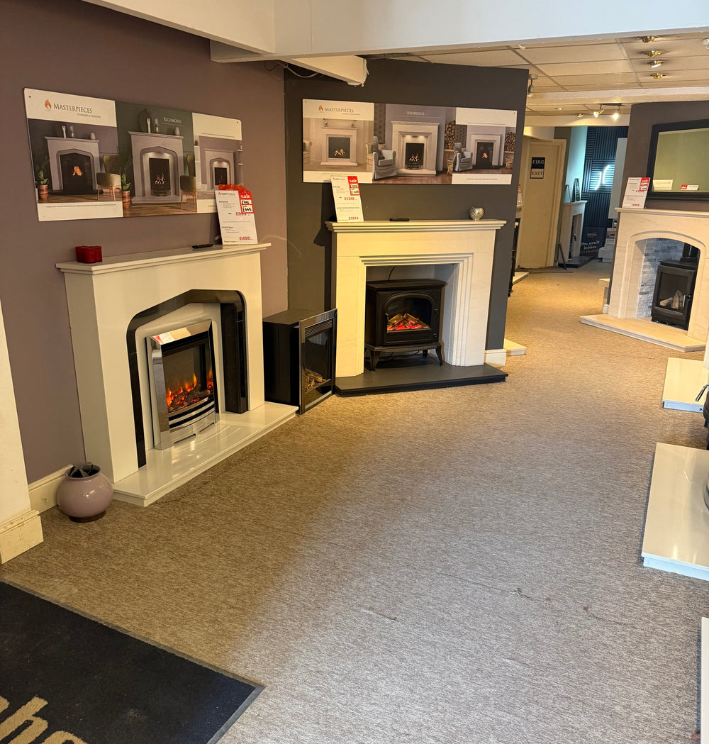 Fireplace surrounds and inset fires on display inside the Bristol showroom
