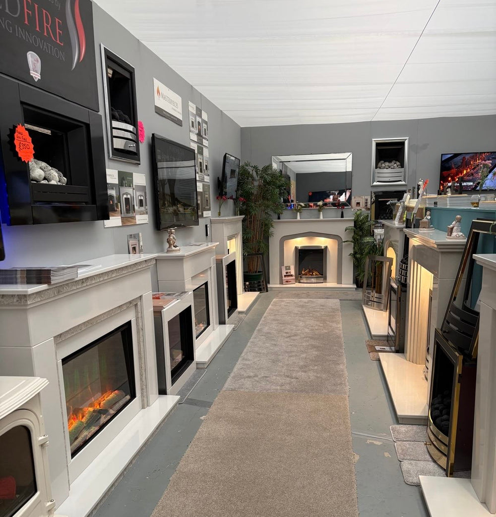 An aisle of fireplace displays inside the Coventry showroom
